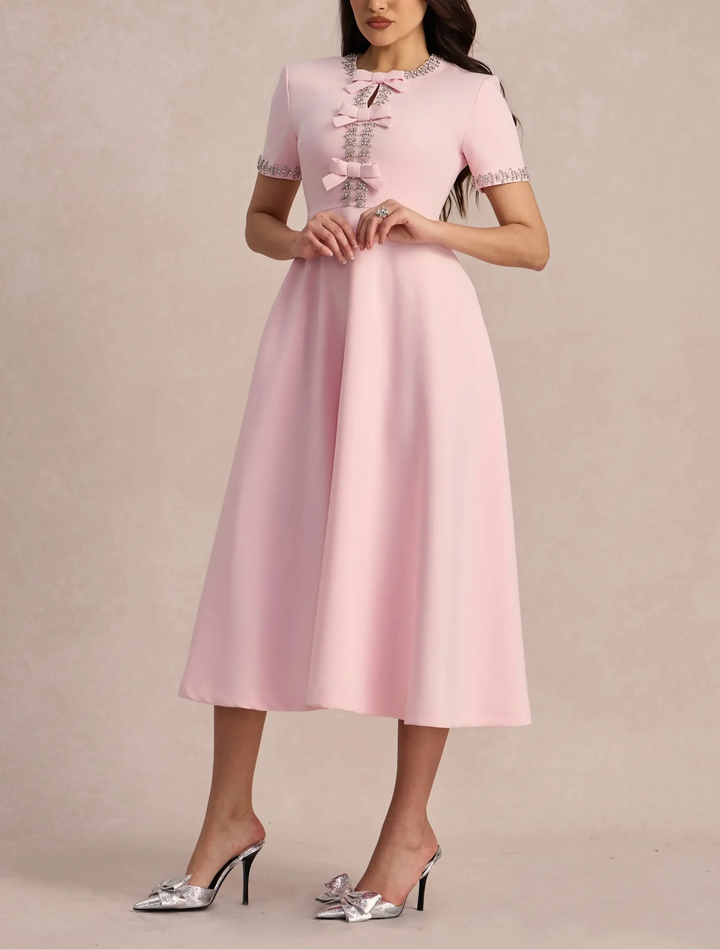 Raffaella | Vestido acampanado con lazos y abalorios