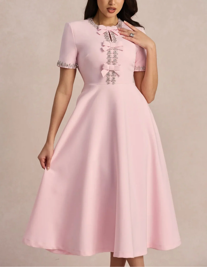 Raffaella | Vestido acampanado con lazos y abalorios