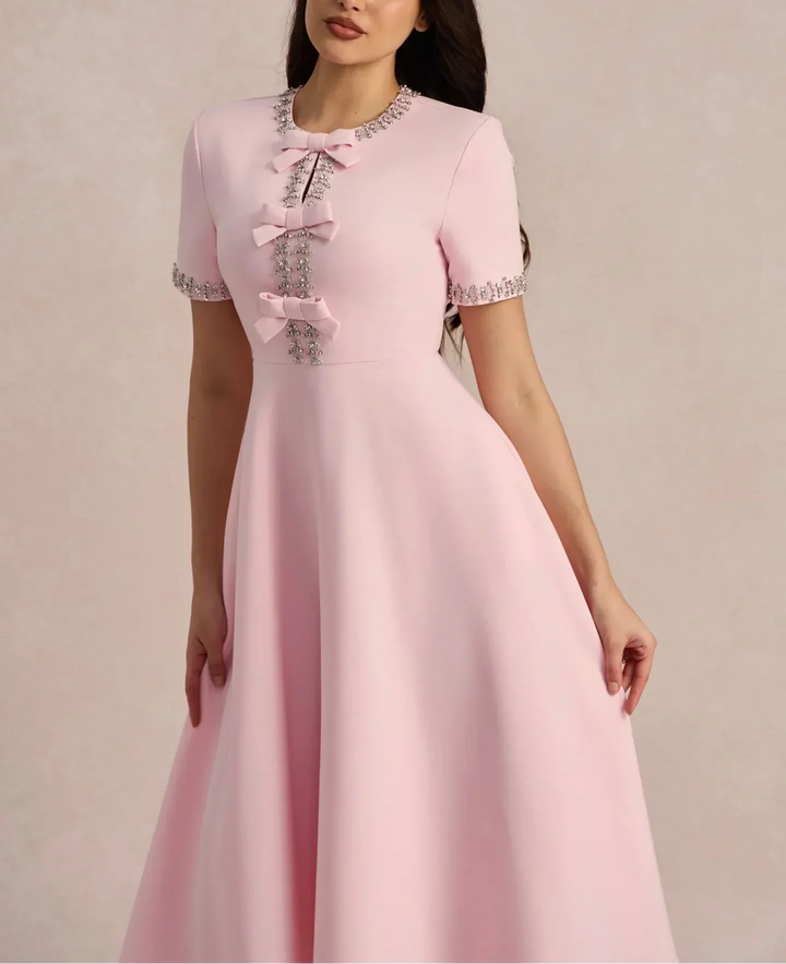 Raffaella | Vestido acampanado con lazos y abalorios