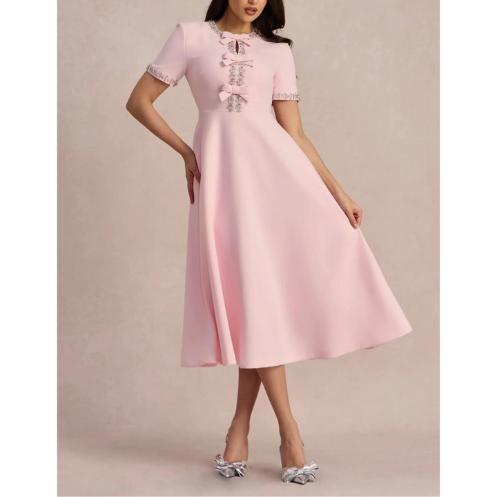 Raffaella | Vestido acampanado con lazos y abalorios