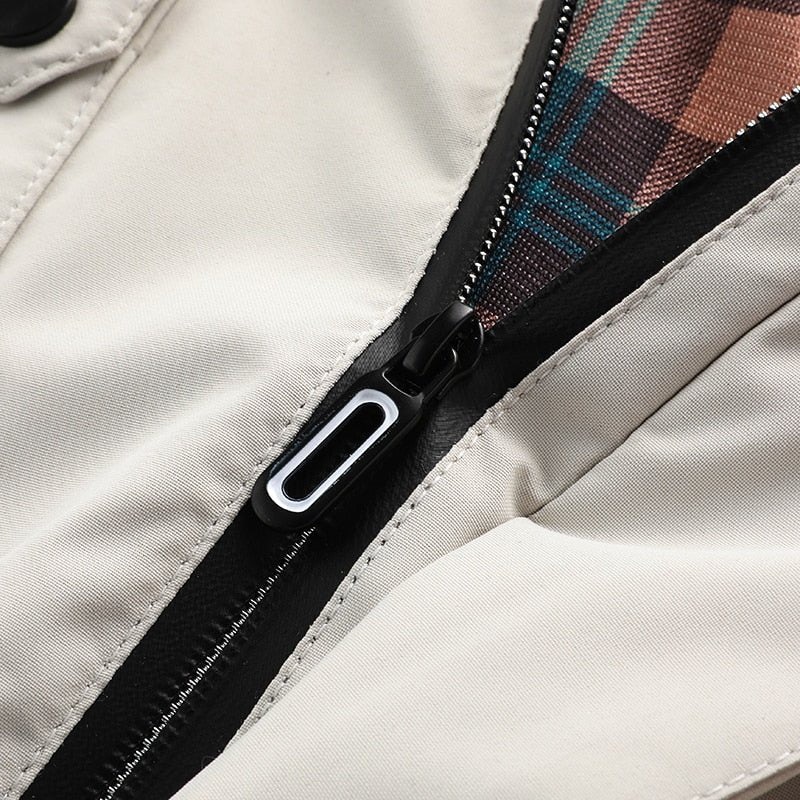 Logan - Chaqueta cómoda impermeable y cortaviento con múltiples bolsillos